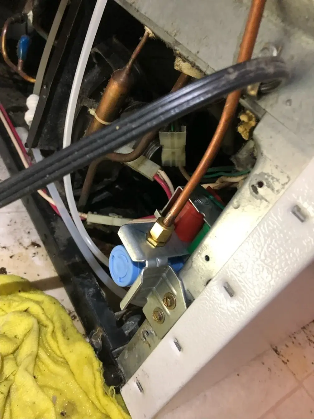 Mr. Fixer technician repairing a Admiral appliance