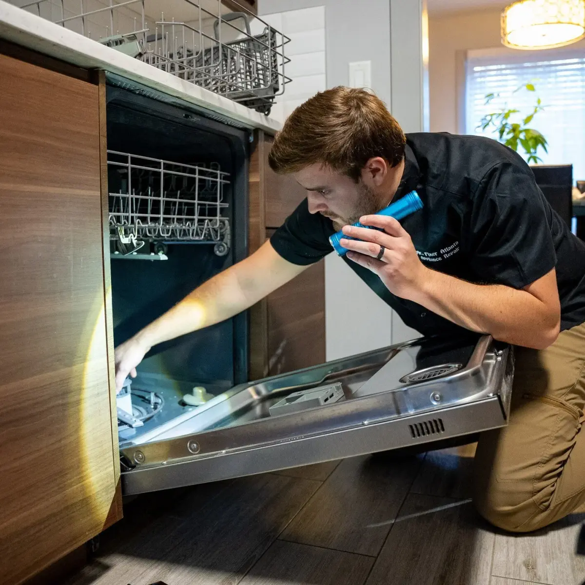 Mr. Fixer technician performing dishwasher repair
