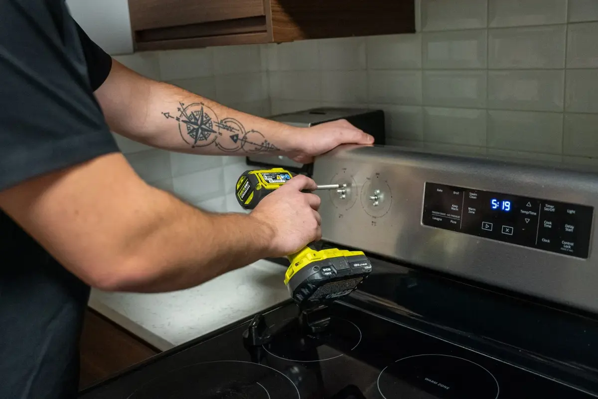 Mr. Fixer technician performing stove & range repair